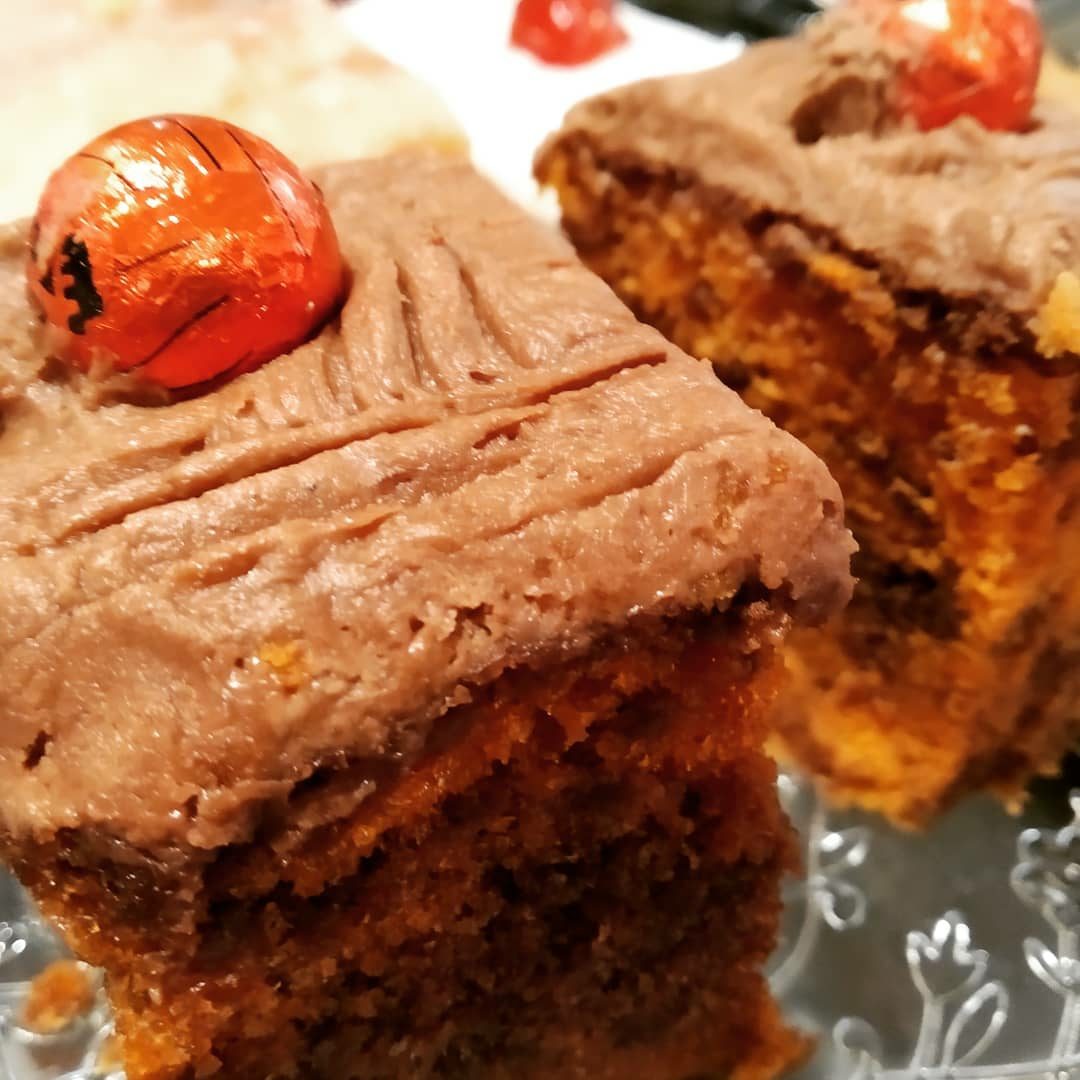 Chocolate-iced cake topped with a chocolate sweet